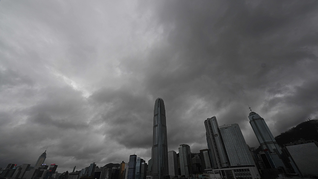Heavy rain clouds are seen over central district as Hong Kong is influenced by Typhoon Koinu on October 8, 2023. /CFP