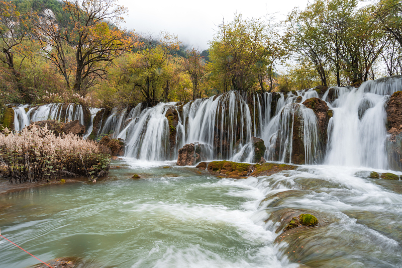 Numerous waterfalls cascade down the mountainsides in the Jiuzhai Valley in Sichuan Province, as seen in this photo taken on October 5, 2023. /CFP