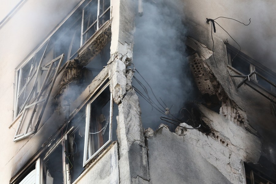 This photo, taken on October 7, 2023, shows a building hit by a rocket in Tel Aviv, Israel. /Xinhua