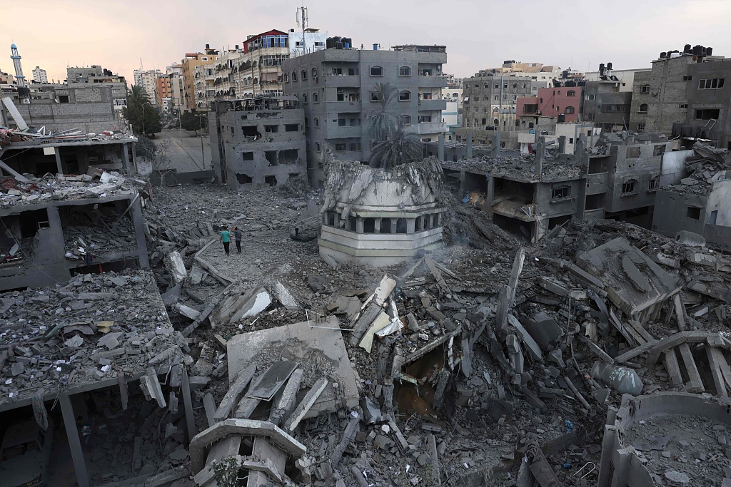 Palestinians inspect the destruction around Ahmed Yassin mosque, which was levelled by Israeli airstrikes, in Gaza, October 9, 2023. /CFP