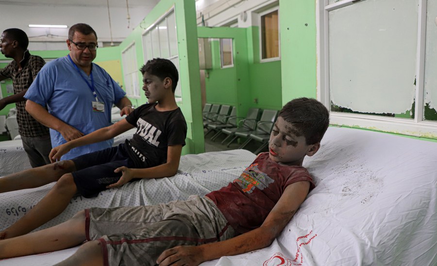 Children injured in an Israeli airstrike are treated at a hospital in Gaza City, October 9, 2023.