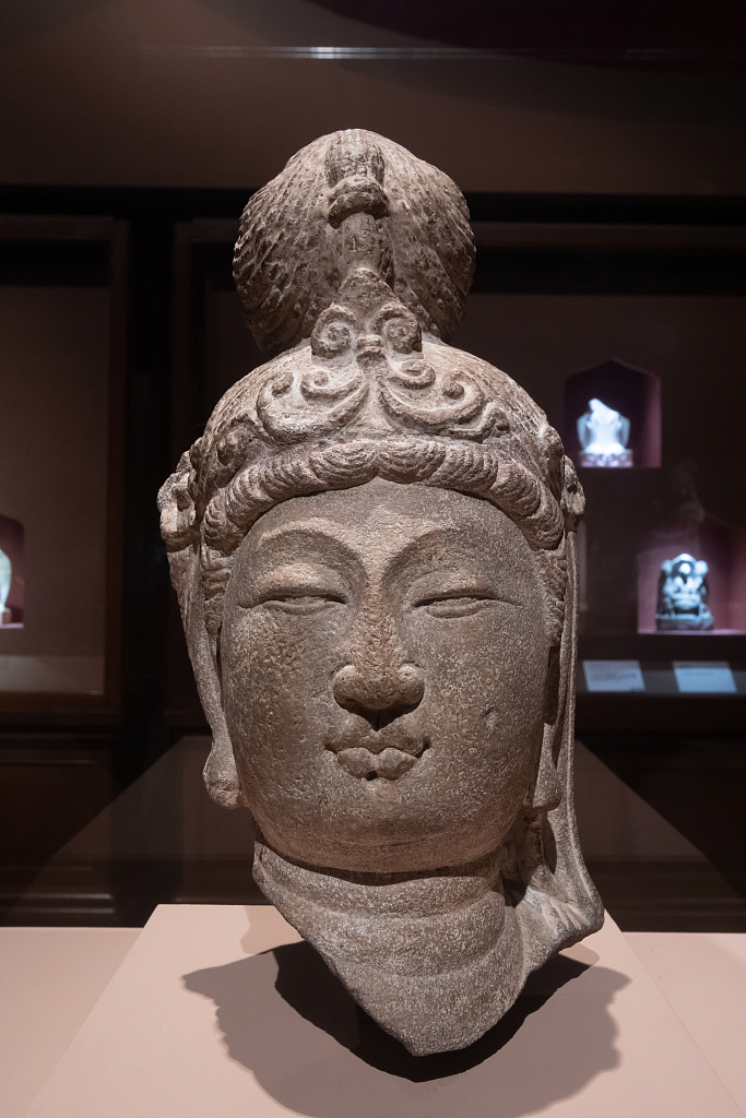 An undated photo shows a stone Buddha head from Cave 18 of the Tianlongshan Grottoes displayed at the National Museum of China, Beijing. /CFP