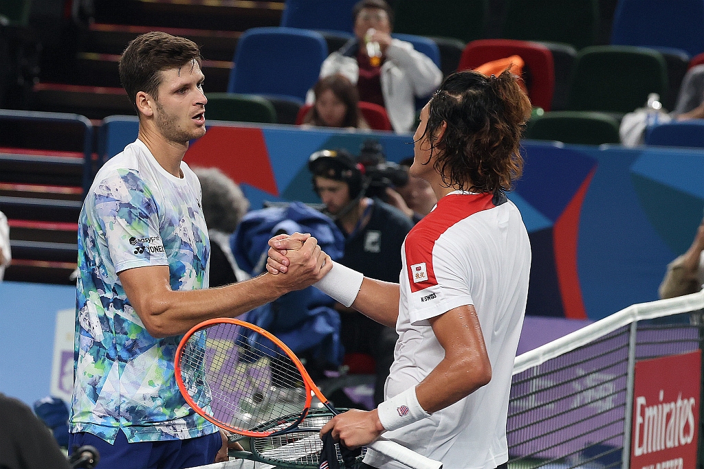 China Zhang Zhizhen's (R) shakes hands with Poland's Hubert Hurkacz during the Shanghai Masters in Shanghai, China, October 11, 2023. /CFP