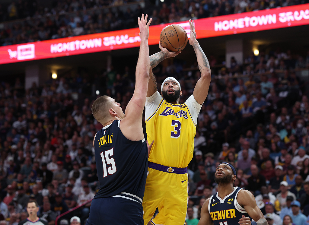 Nikola Jokic (#15) of the Denver Nuggets tries to deflect a shot by Anthony Davis of the Los Angeles Lakers in Game 2 of the NBA Western Conference Finals at Ball Arena in Denver, Colorado, May 18, 2023. /CFP