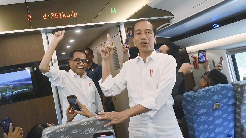 Indonesian President Joko Widodo reacts when the screen shows a speed of 351 kilometers per hour inside the Jakarta-Bandung high-speed rail during a test ride in Jakarta, Indonesia, September 13, 2023. /CFP