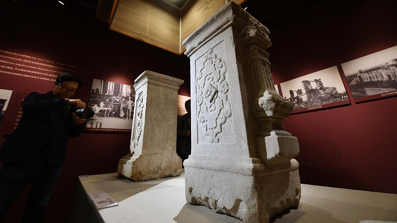 Two pillars with carvings are displayed in the Old Summer Palace, Beijing, October 13, 2023. /CFP