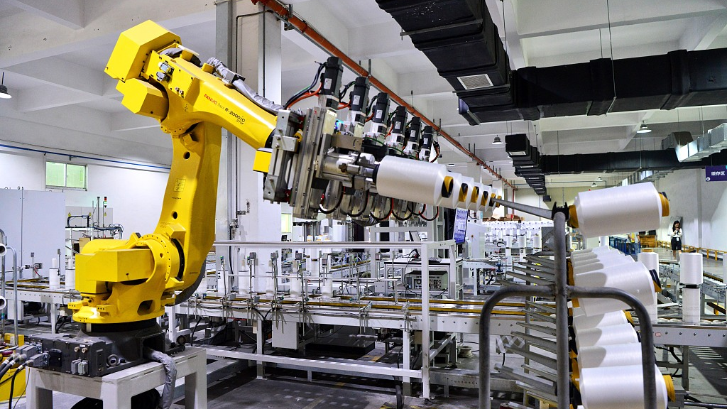 Robots were working on the production line in the intelligent workshop in Fuzhou, Fujian Province China, May 31, 2023. /CFP

