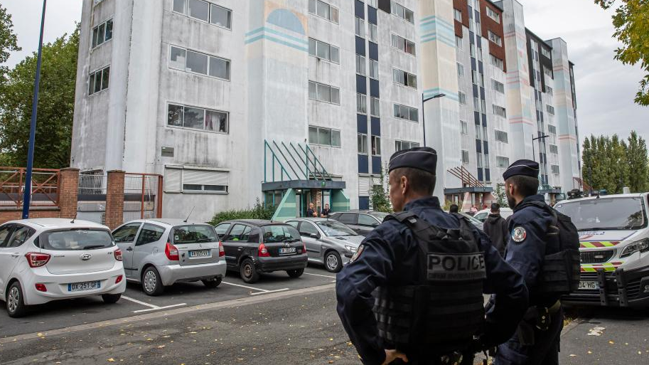 Policemen guard outside the suspect's apartment in Arras, France, October 13, 2023. /Xinhua