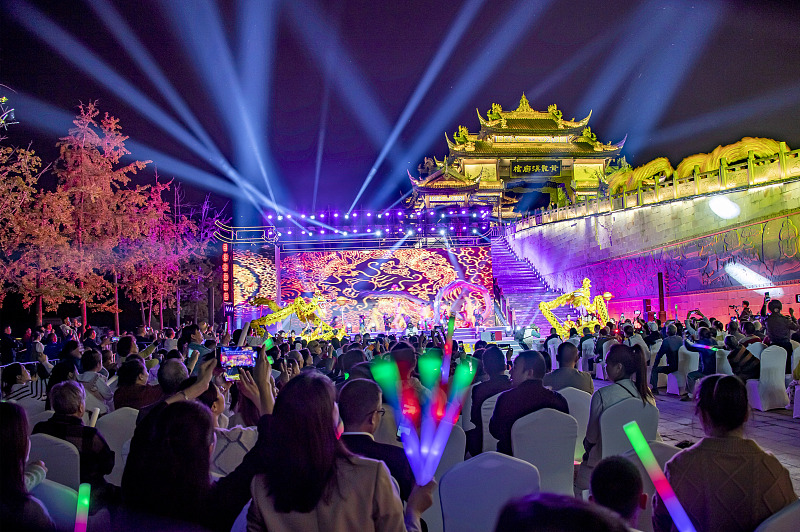 Visitors appreciate night shows at the 8th International Festival of the Intangible Cultural Heritage in Chengdu City, Sichuan Province, October 13, 2023. /CFP