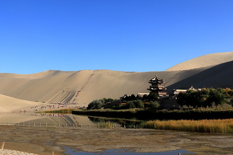 As one of Gansu Province's most famous tourist spots, the Mingsha Mountain Crescent Spring Scenic Area attracts tens of thousands of visitors a year. /CFP