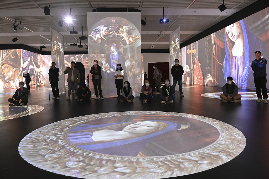 Visitors enjoy an immersive experience that allows them to take a closer look at Renaissance masterpieces from the Uffizi Galleries collection at the National Museum of China in Beijing, April 27, 2023. /CFP