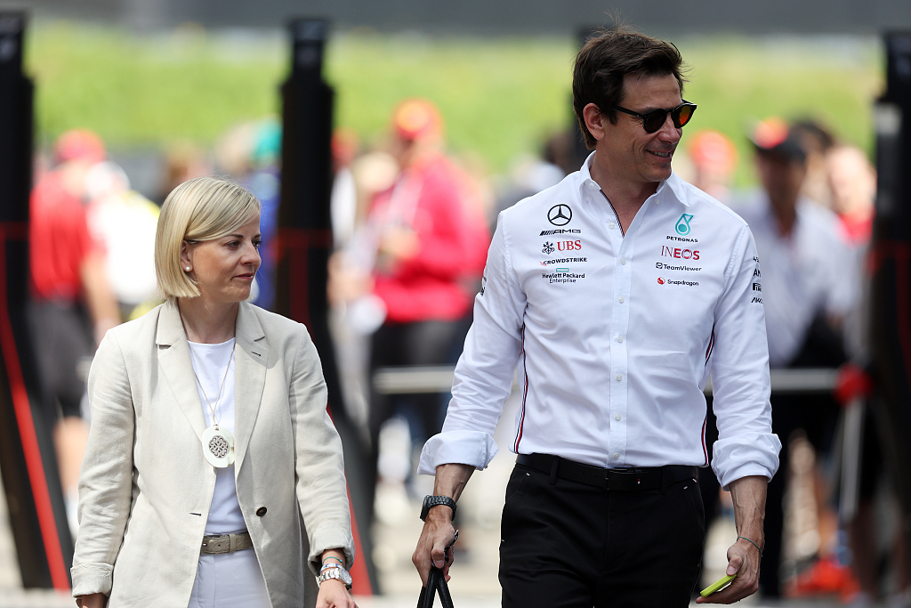 Susie Wolff (L) and her husband Toto Wolff, F1 Mercedes executive director, walk in the Paddock prior to the F1 Grand Prix of Austria at Red Bull Ring in Spielberg, Austria, July 2, 2023. /CFP