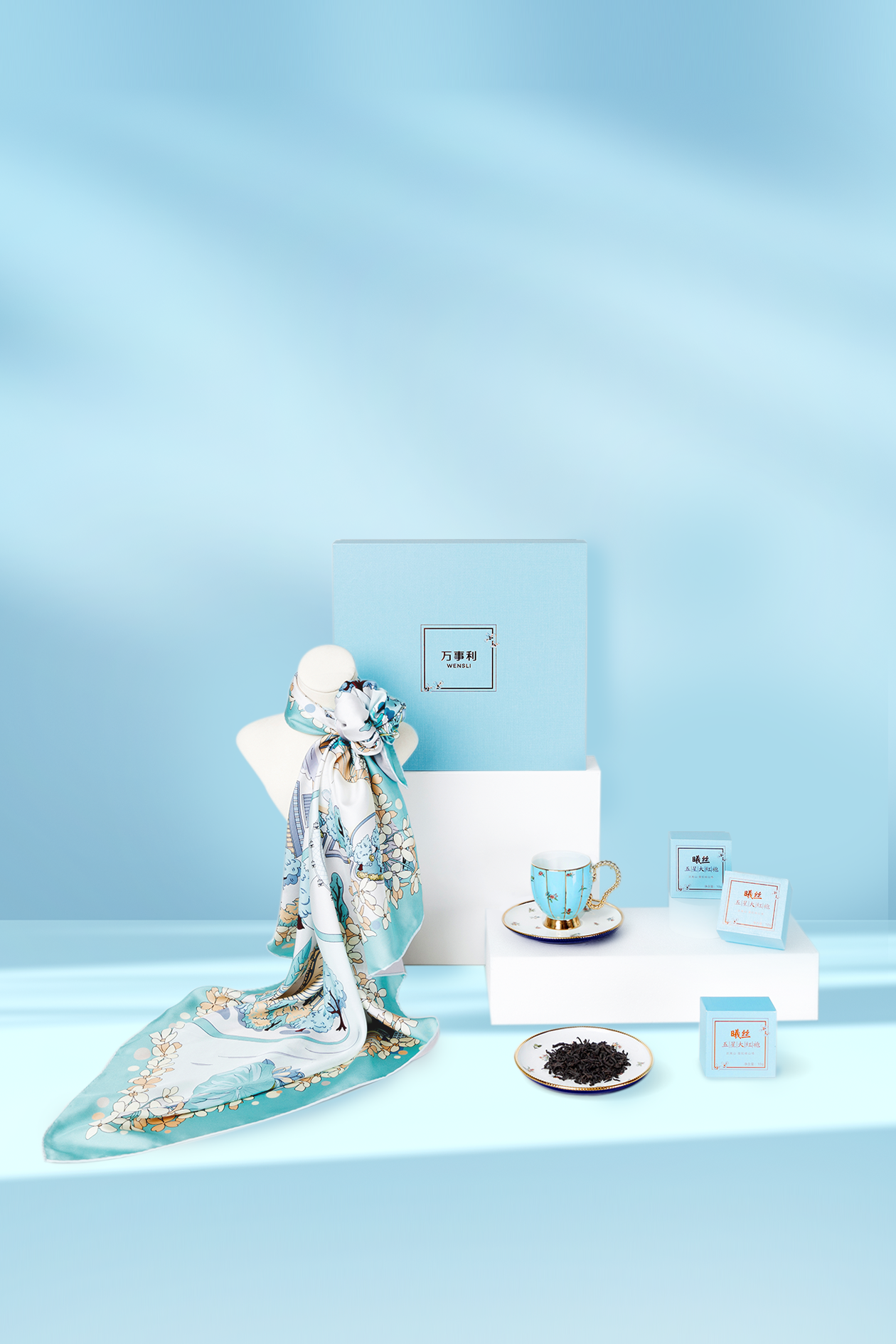 A gift box features a tea set and a silk scarf created by a time-honored Chinese brand. /Photo provided to CGTN