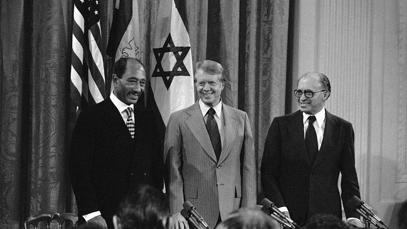 From left, Egyptian President Anwar Sadat, U.S. President Jimmy Carter and Israeli Prime Minister Menachen Begin gather in the East Room of the White House in Washington on September 17, 1978, to sign two documents containing an agreement between Israel and Egypt to terms designed to end their conflict. /CFP