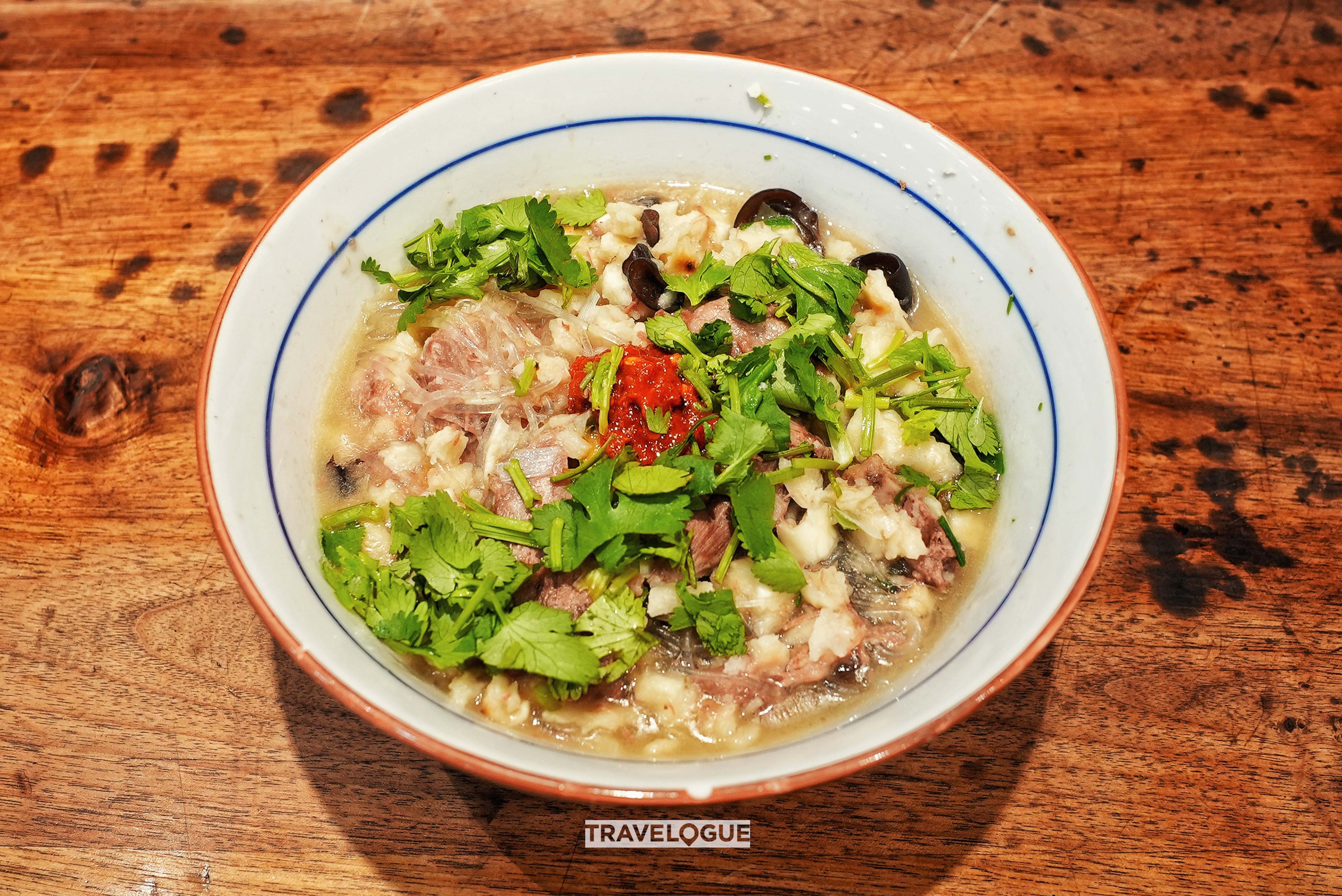 Yangrou paomo, or shredded pita bread soaked in mutton soup, a dish from Xi'an, Shaanxi Province /CGTN