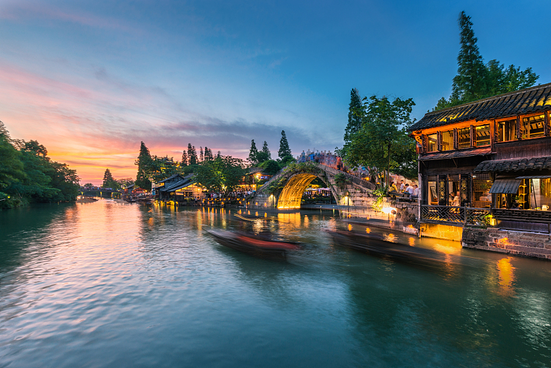 A beautiful sunset offers the perfect backdrop to this scene of the ancient town of Wuzhen in Zhejiang Province. /CFP