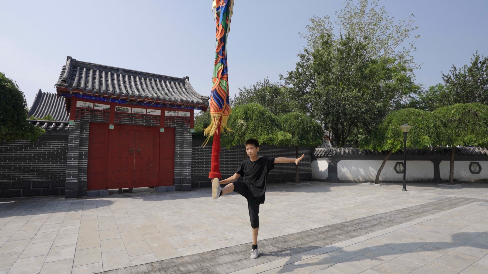 Han Jiacheng, a 15-year-old boy from Cangzhou, Hebei Province, practices Zhongfan performing stunts. /CGTN