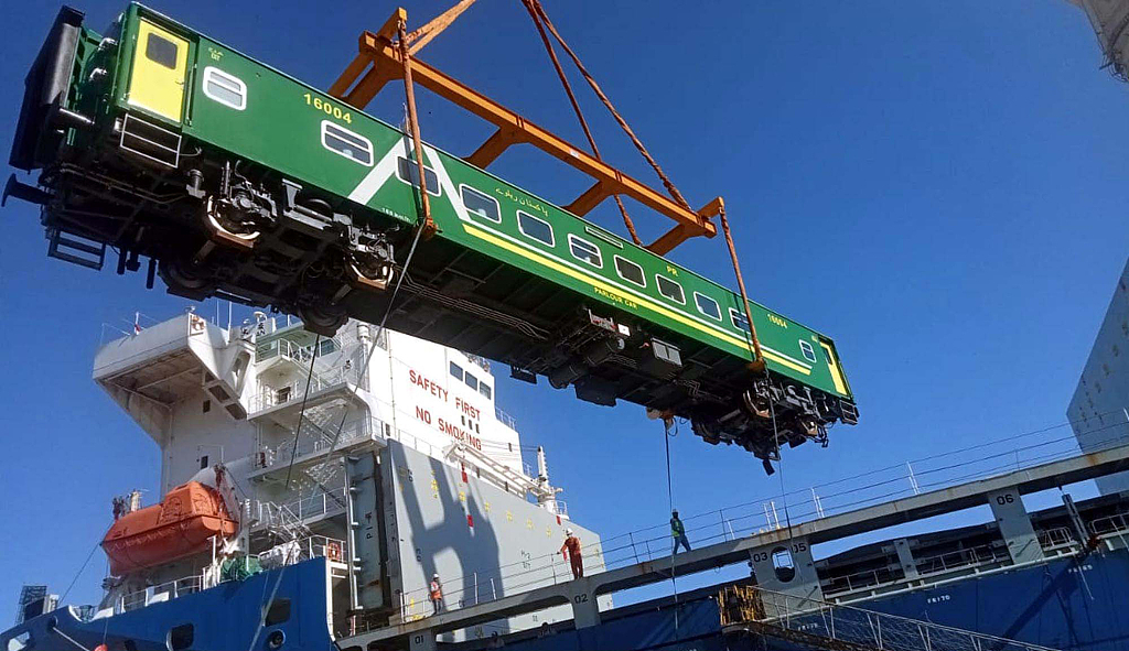 View of crane unloading new high-speed passenger coaches, Karachi Port, Pakistan, November 27, 2022. /CFP