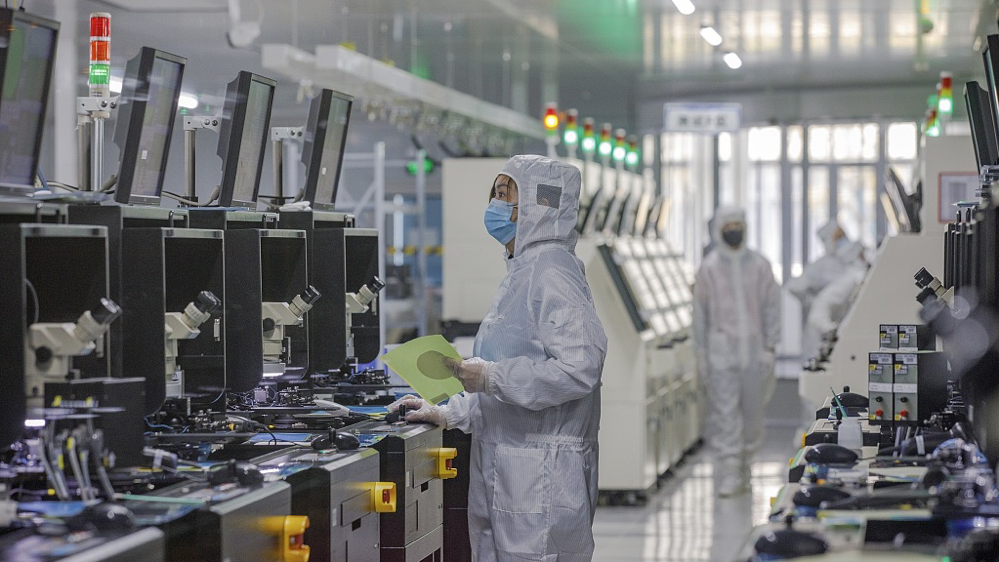 Technicians work in the workshop of Jiangsu Nuanyang Semiconductor Technology Co., Ltd., in Lianyungang, east China's Jiangsu Province, April 14, 2023. /CFP