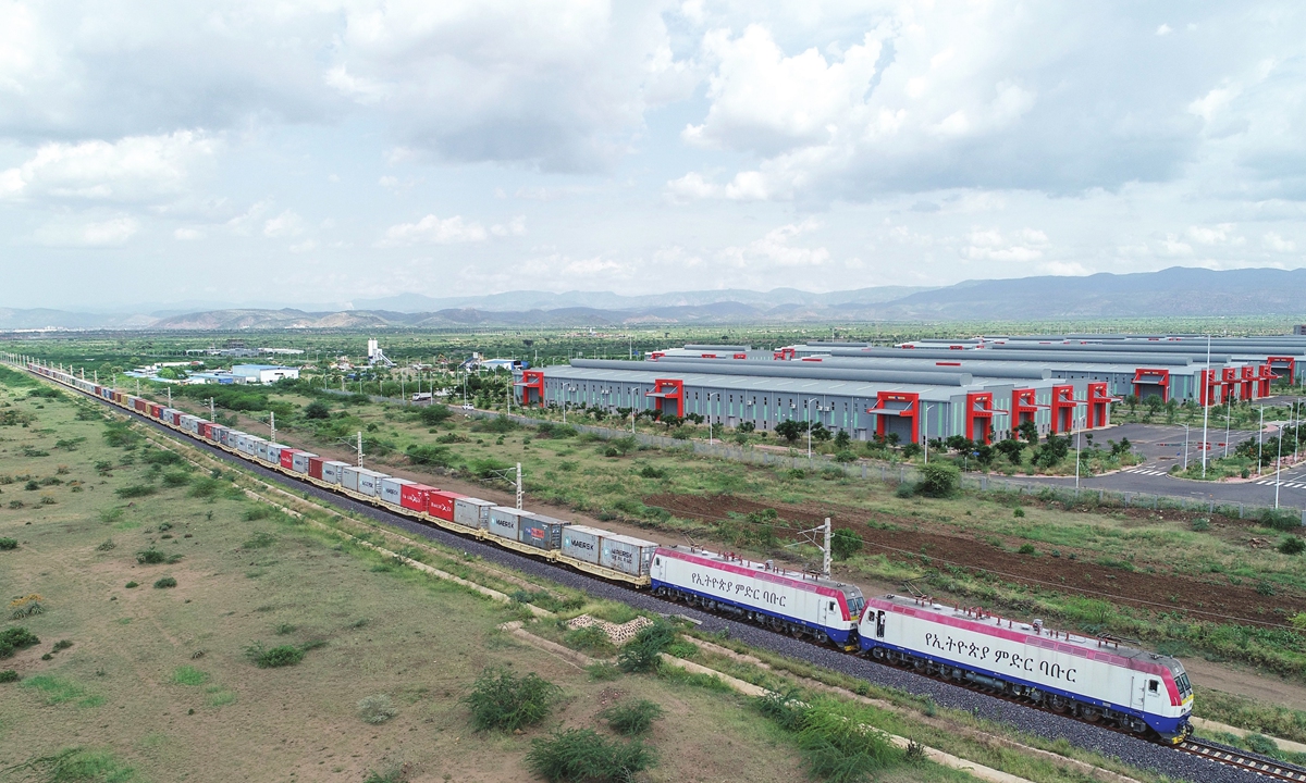 A freight train runs through an industrial park in Ethiopia along the Ethiopia-Djibouti Railway. /China Civil Engineering Construction Corporation (CCECC)