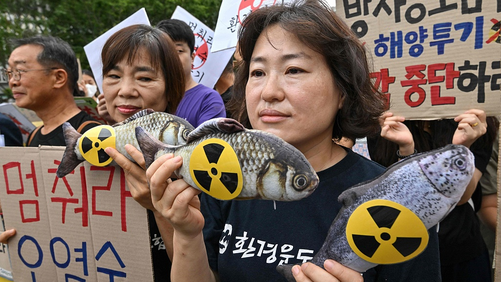 South Korean environmental activists hold fish dolls with radioactive signs during a rally against the Japanese government's plan to release wastewater from the Fukushima-Daiichi nuclear plant into the Pacific Ocean, at Gwanghwamun Square in Seoul, August 24, 2023. /CFP