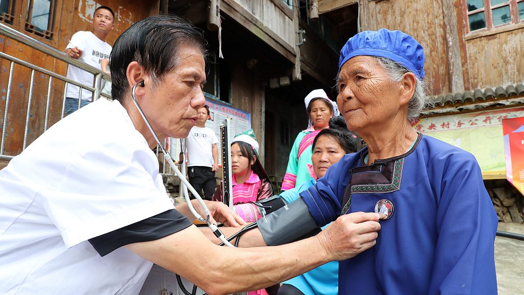 Doctor from Xincheng Hospital checks health condition of a local elderly in Rongjiang County, Qiandongnan Miao and Dong Autonomous Prefecture, southwest China's Guizhou Province, September 8, 2023. /CFP