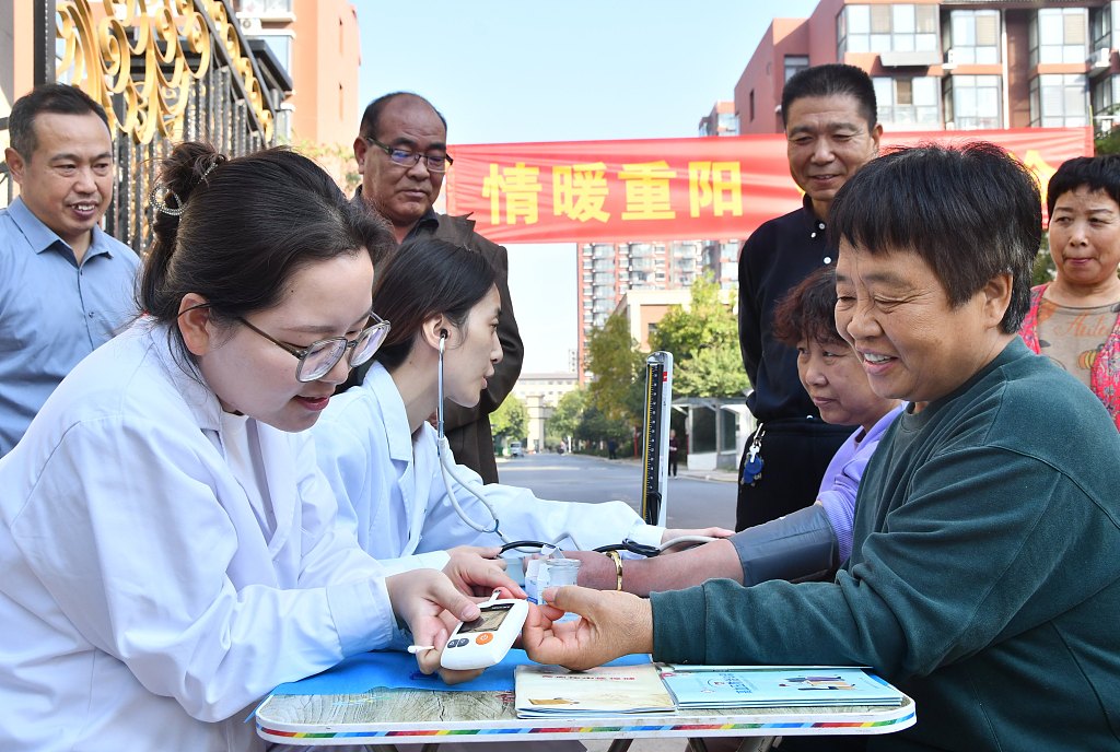 Medical workers offer free medical services to a local elderly group to honor the Chongyang Festival in Handan, north China's Hebei Province, October 23, 2023. /CFP