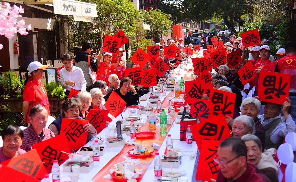 Elderly residents from a local community enjoy a get-together to celebrate the Chongyang Festival in Hangzhou, east China's Zhejiang Province, October 23, 2023. /CFP