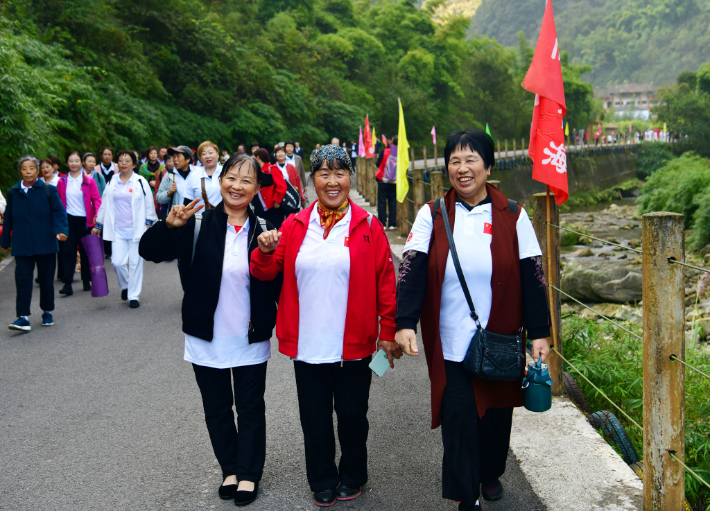 A mountain-climbing activity is held as part of local celebrations for the Chongyang Festival, an occasion to extend care and love to the elderly in traditional Chinese culture, in Yichang, central China's Hubei Province, October 22, 2023. /CFP