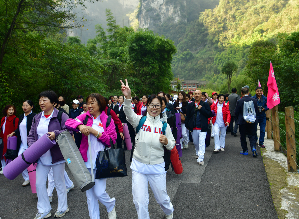 A mountain-climbing activity is held as part of local celebrations for the Chongyang Festival, an occasion to extend care and love to the elderly in traditional Chinese culture, in Yichang, central China's Hubei Province, October 22, 2023. /CFP