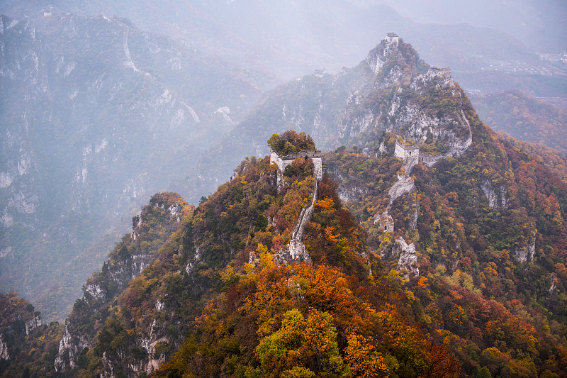 Colorful tree-covered mountains offer stunning autumnal views at the Jiankou section of the Great Wall in Beijing. /CFP