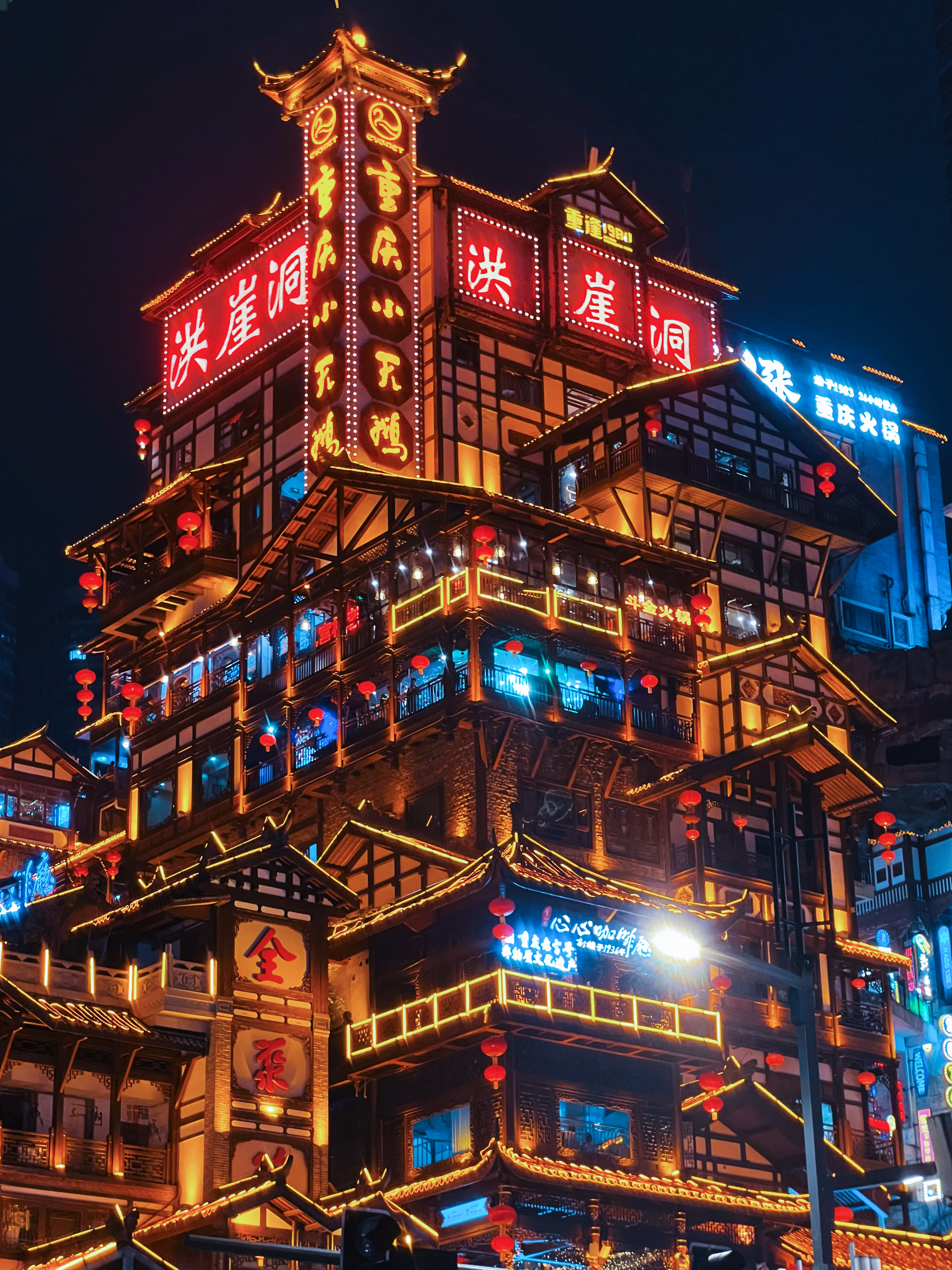 Spectacular lights illuminate the skies above the over 2,300-year-old Hongya Cave in Chongqing on October 19, 2023, adding to the sci-fi-like atmosphere of this famous 