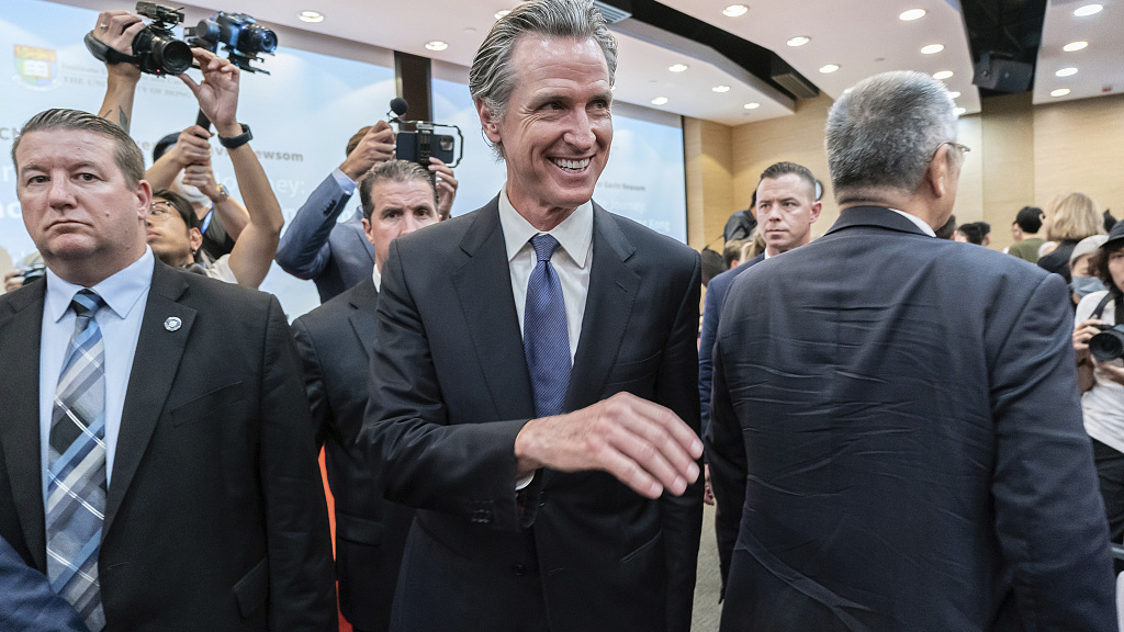 California Governor Gavin Newsom, center, leaves the lecture hall after attending the fireside chat at the Hong Kong University in China's Hong Kong Special Administrative Region, October 23, 2023. /CFP