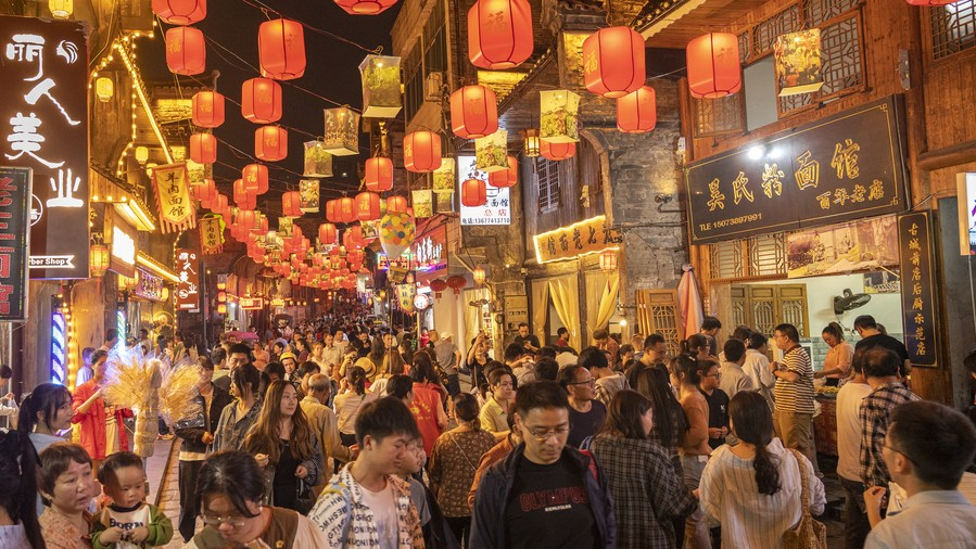 Tourists visit Xiangdong Street of Xinhua County, central China's Hunan Province, October 2, 2023. /Xinhua