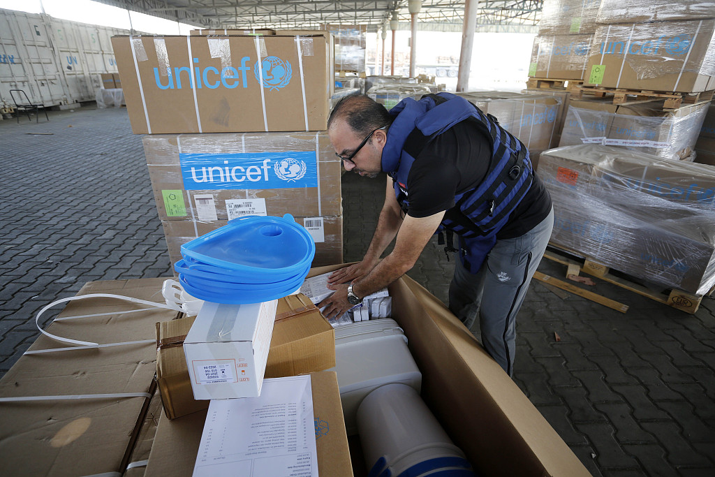 UNRWA workers at a warehouse in Deir Al-Balah, Gaza pack medical aid and prepare it for distribution to hospitals, October 25, 2023. /CFP