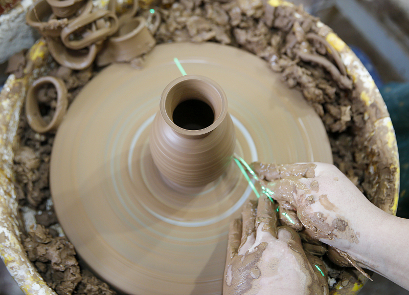 As ancient Chinese artifacts, painted pottery requires a series of intricate processes to complete, as seen in this photo taken October 18, 2023 in Mianchi County, Henan Province. /CFP