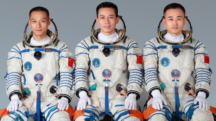 Chinese astronauts Tang Hongbo (C), Tang Shengjie (R) and Jiang Xinlin who will carry out the Shenzhou-17 spaceflight mission. /Xinhua