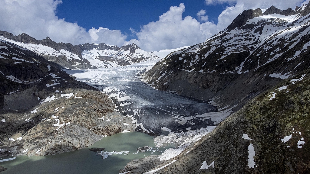 A lake of meltwater has formed due to climate change on the tongue of the Rhone Glacier near Goms, Switzerland, on June 13, 2023. /CFP