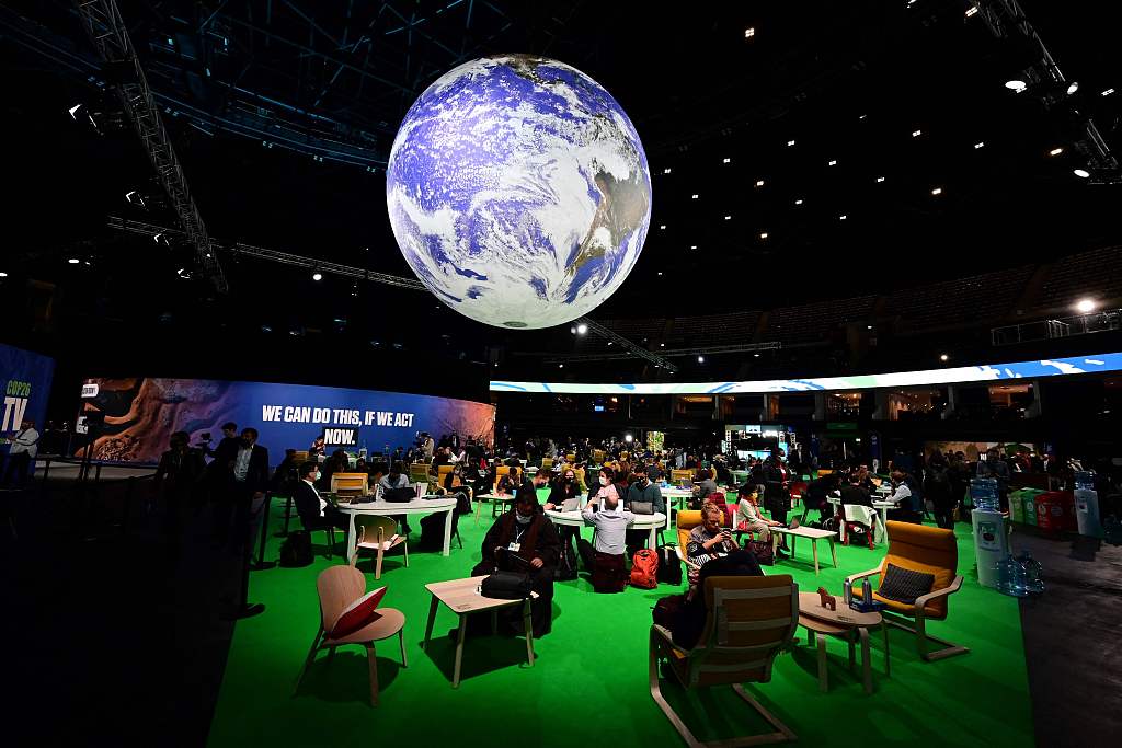 Delegates sit in the Action Zone as they attend the third day of the 2021 United Nations Climate Change Conference in Glasgow, United Kingdom, November 3, 2021. /CFP