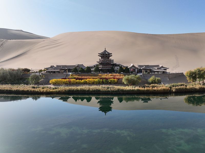 The crystal clear waters reflect the natural beauty of the Mingsha Mountain Crescent Spring Scenic Area in Dunhuang City, Gansu Province, October 28, 2023. /CFP