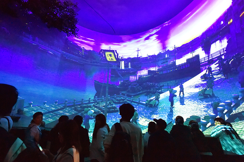 Visitors enjoy a Grand Canal-themed multimedia exhibition at the Yangzhou China Grand Canal Museum in Jiangsu Province, October 27, 2023. /CFP