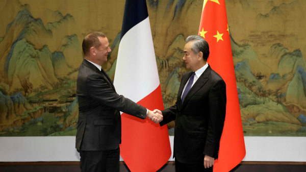 Wang Yi (R), a member of the Political Bureau of the Communist Party of China (CPC) Central Committee and director of the Office of the Central Commission for Foreign Affairs, shakes hands with the French president's diplomatic counselor, Emmanuel Bonne, in Beijing, China, October 30, 2023. /Chinese Foreign Ministry