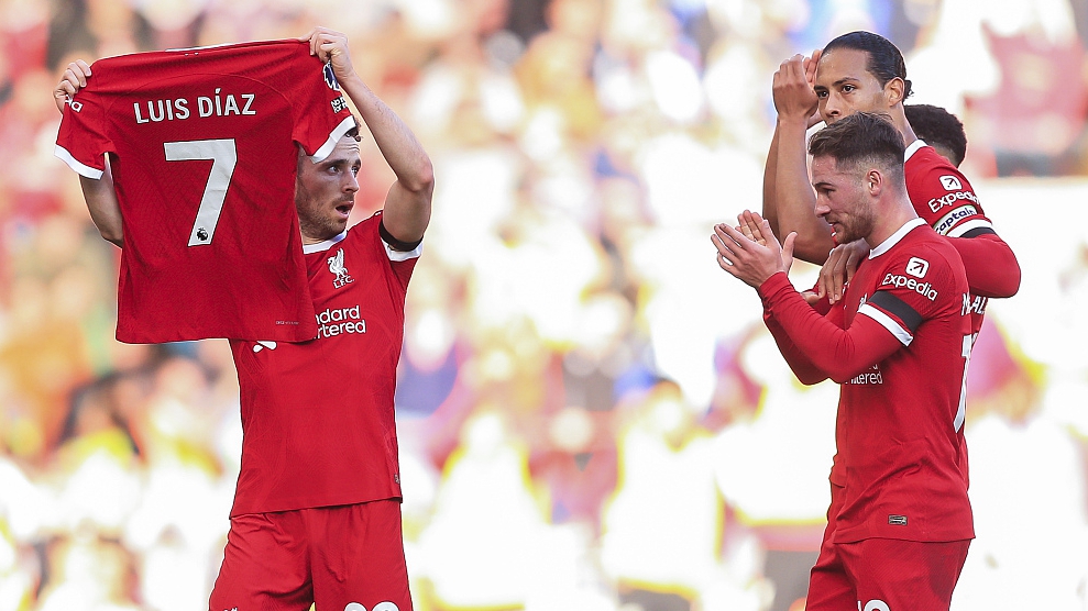 Diogo Jota of Liverpool holds up the shirt of teammate Luis Diaz after scoring at Anfield in Liverpool, England, October 29, 2023. /CFP