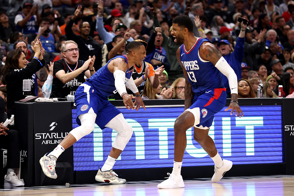 Russell Westbrook (L) and Paul George of the Los Angeles Clippers react after making a shot in the game against the Orlando Magic at the Crypto.com Arena in Los Angeles, California, October 31, 2023. /CFP