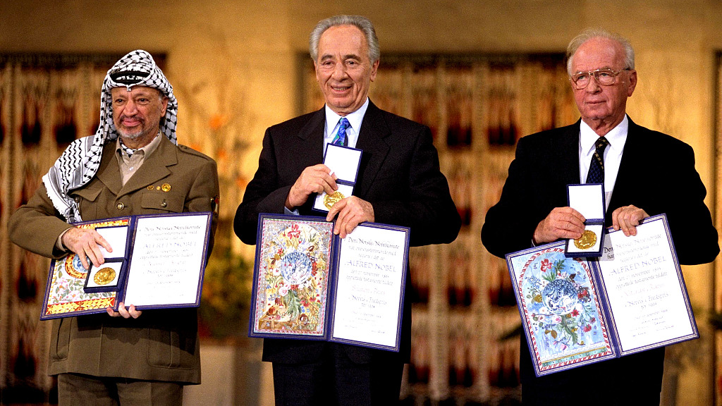 This handout from the Government Press Office shows (R-L) Israeli Prime Minister Yitzak Rabin, Israeli Foreign Minister Shimon Peres and Palestinian leasder Yaser Arafat, the joint Nobel Peace Prize winners for 1994, in Olso, Norway. /CFP