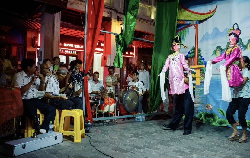 Folk artists perform the Hainan Doll Opera. /Photo provided to CGTN