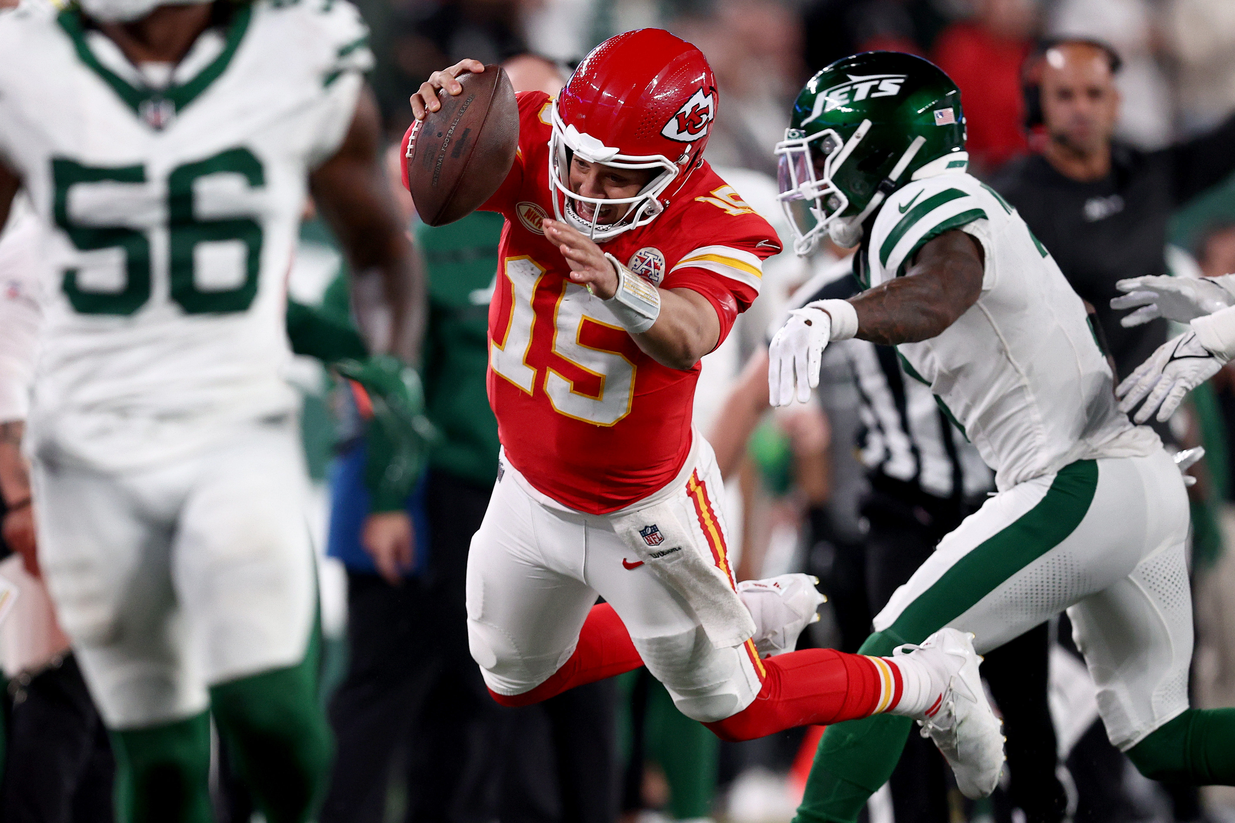 Quarterback Patrick Mahomes (#15) of the Kansas City Chiefs leaps for extra yards in the game against the New York Jets at MetLife Stadium in East Rutherford, New Jersey, October 1, 2023. /CFP