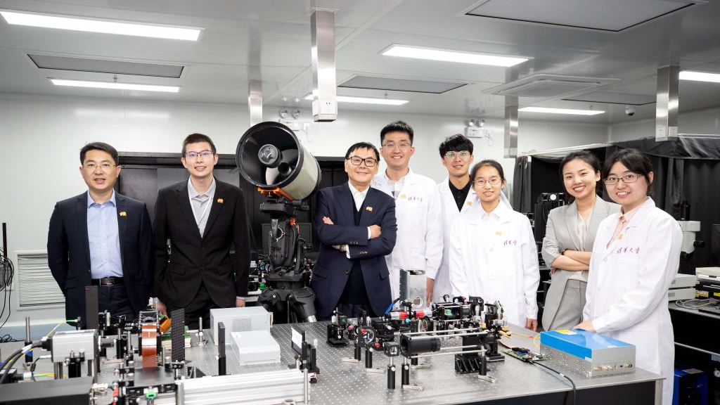 Members of the research team that developed an all-analog photoelectronic chip pose for a group photo at Tsinghua University in Beijing, China, April 20, 2021. /CMG 