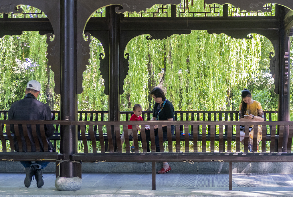 Residents resting in a pocket park on a summer day in Beijing. /CFP
