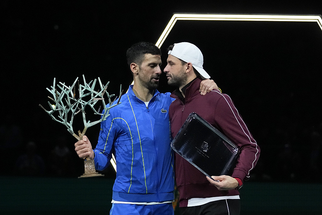 Novak Djokovic (L) and Grigor Dimitrov hug each other at the end of the men's singles final match at the Paris Masters in Paris, France, November 5, 2023. /CFP